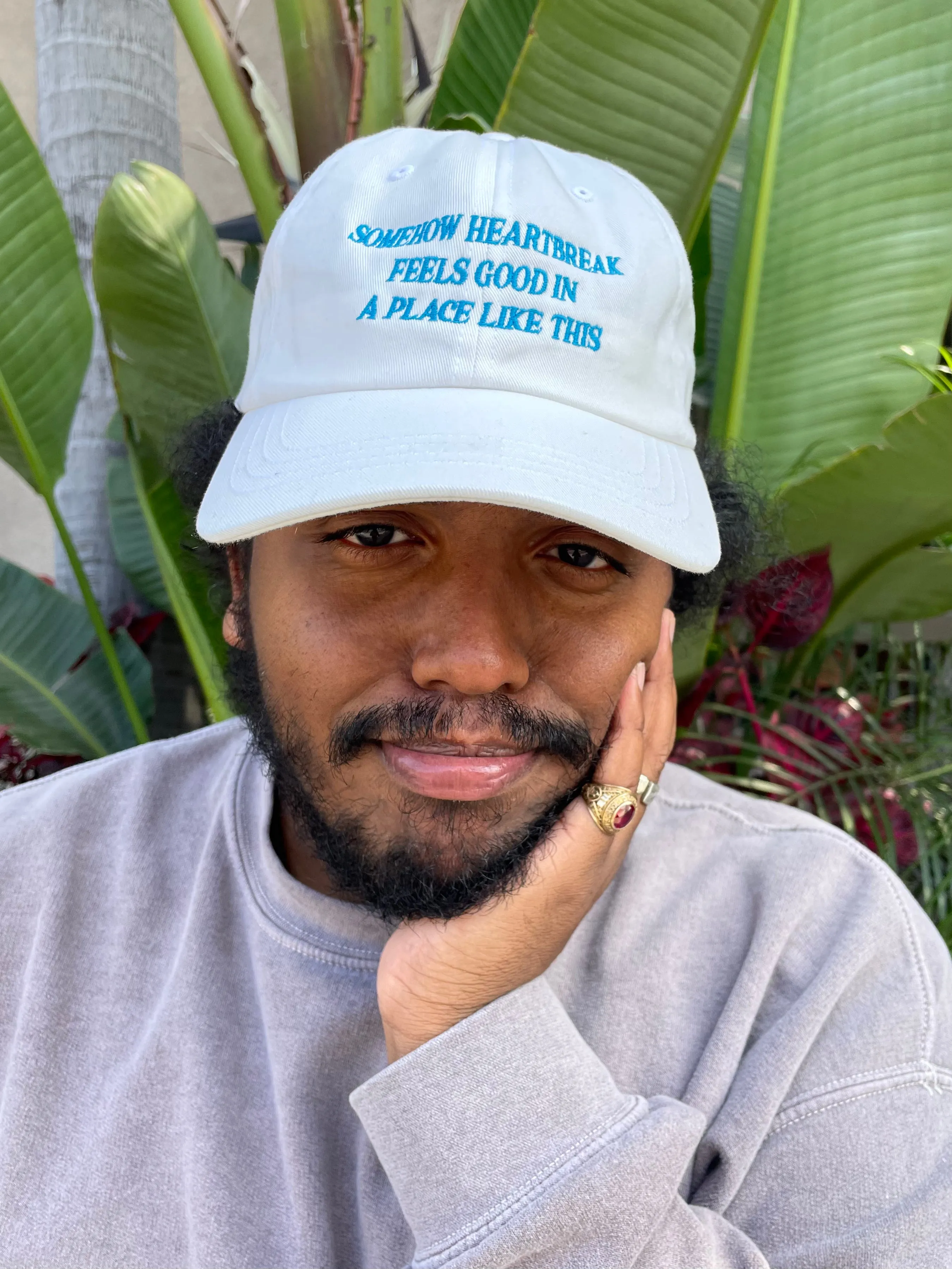 Somehow Heartbreak Feels Good In A Place Like This Hat