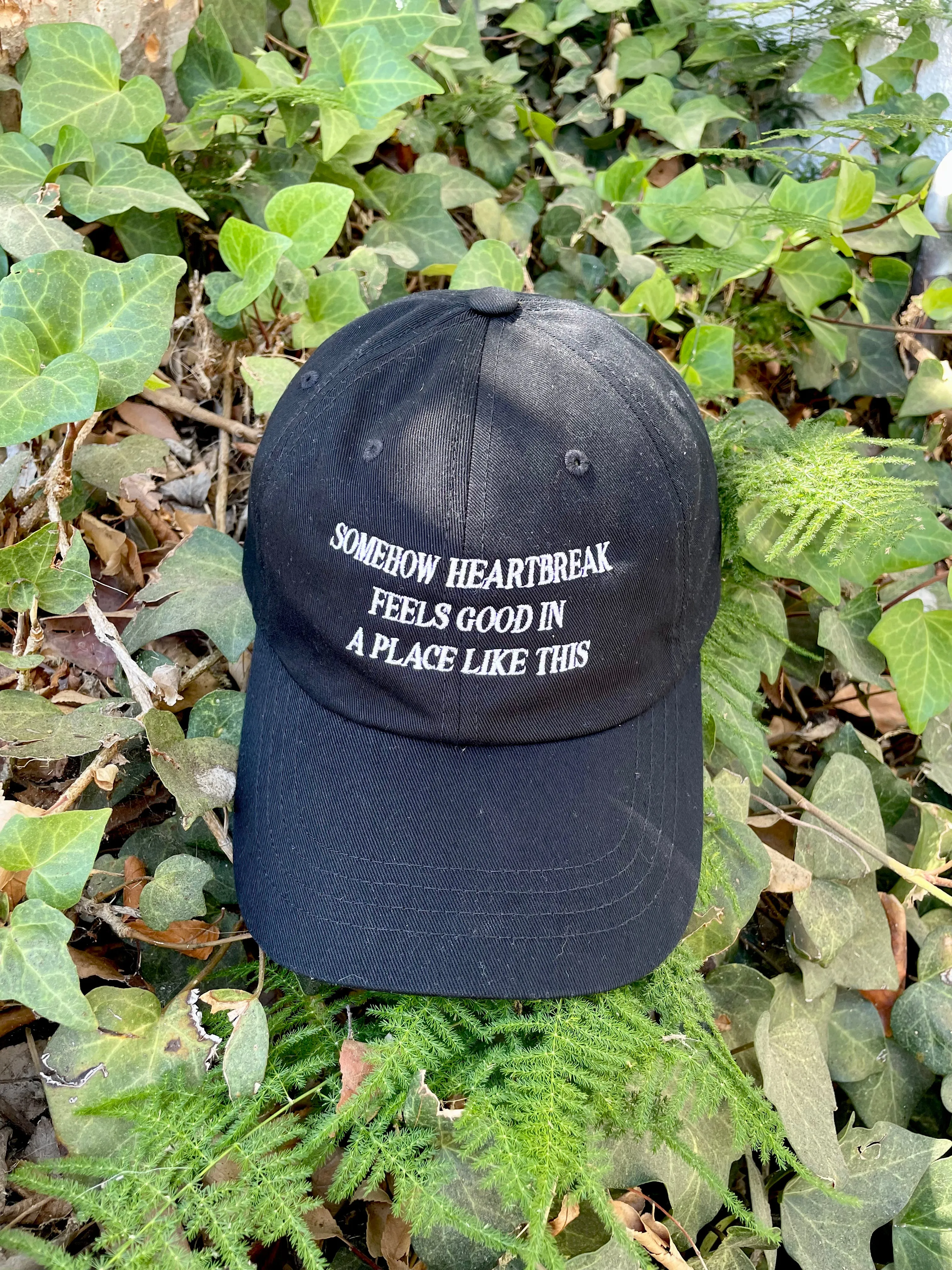 Somehow Heartbreak Feels Good In A Place Like This Hat