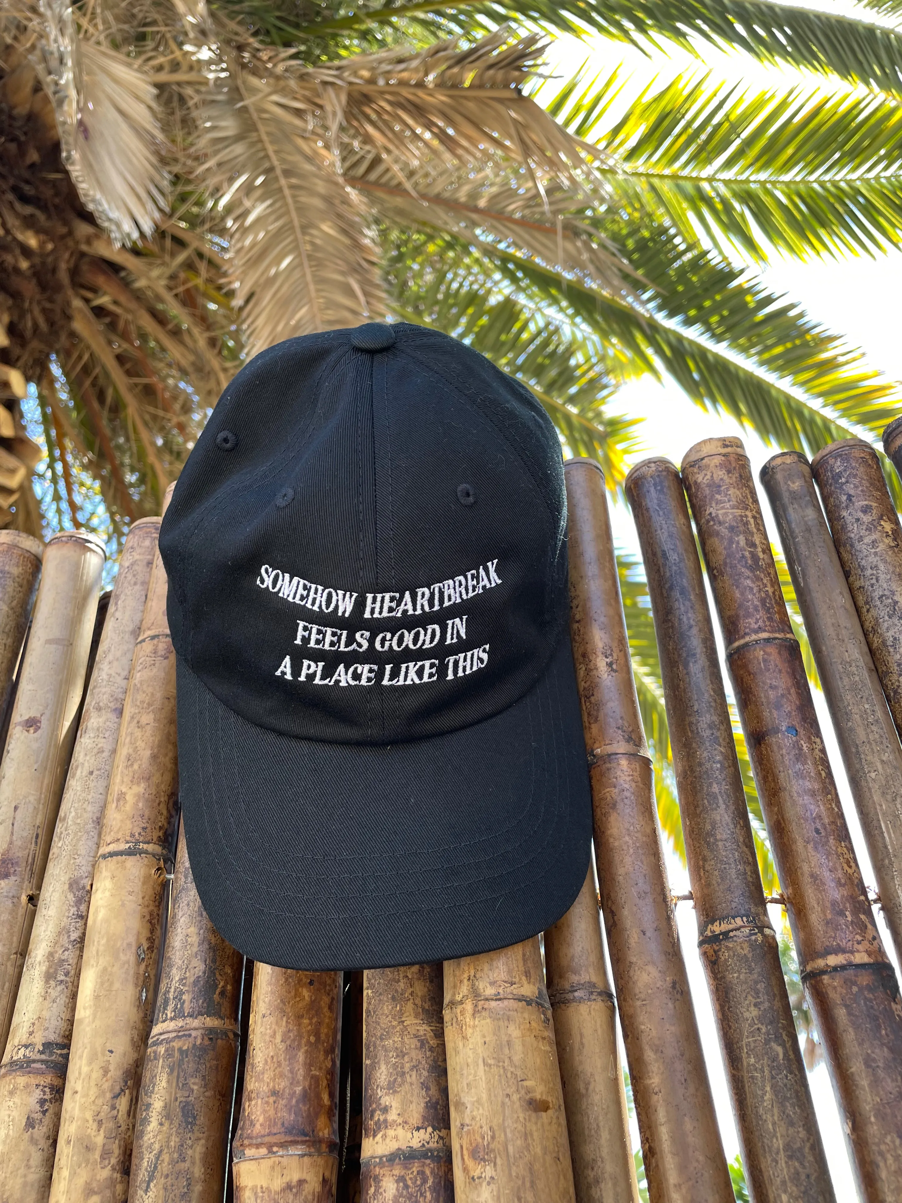 Somehow Heartbreak Feels Good In A Place Like This Hat