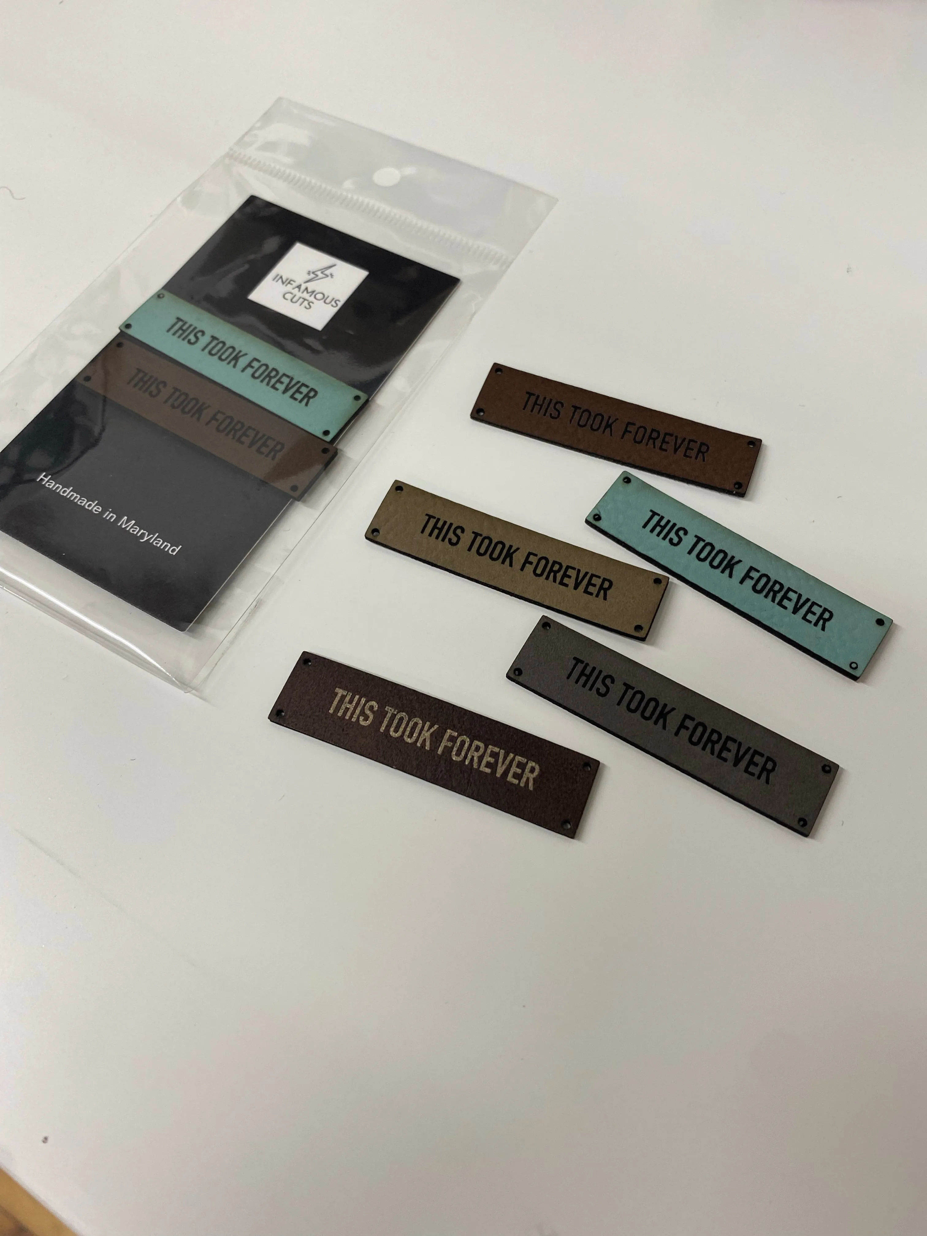 This Took Forever leather label — Infamous Cuts